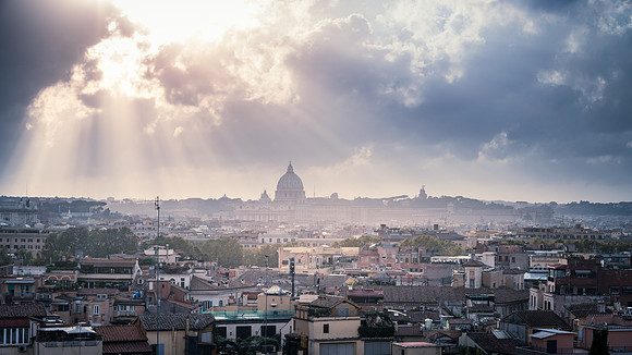 Rooftops of Rome under dramatic sky